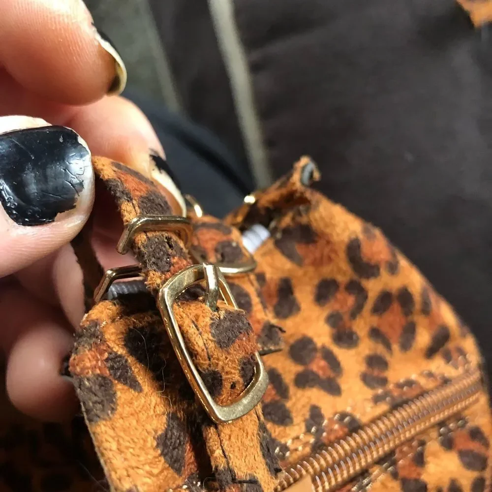 New never worn animal print buckle sandals. Side clasps . Zipper up the back.